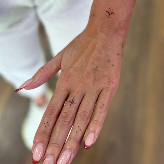 Tiny Minimalist Stars on Women Fingers Tattoo by @street_tattoo_studio