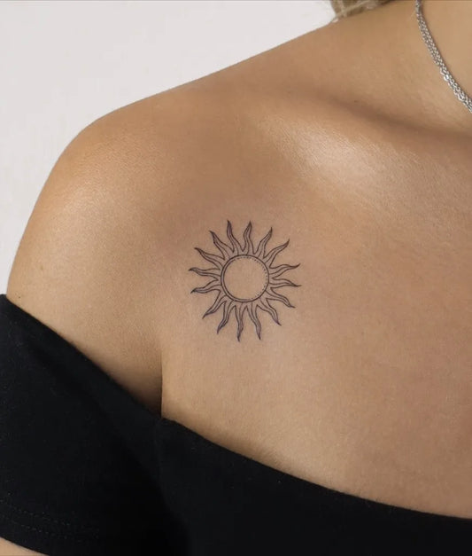 Tiny Minimalist Sun on Women Shoulder Tattoo by @tude.ink
