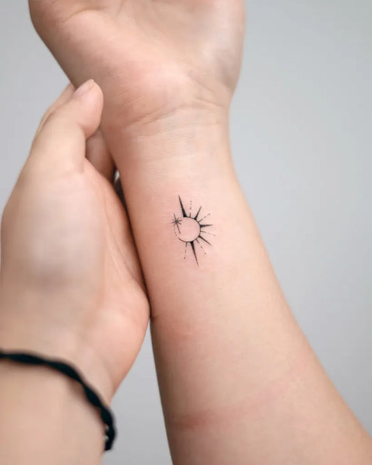 Tiny Minimalist Sun on Women Wrist Tattoo by @handitrip