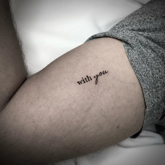 Tiny Minimalist Text on Men Thigh Tattoo by @sik.tattoo