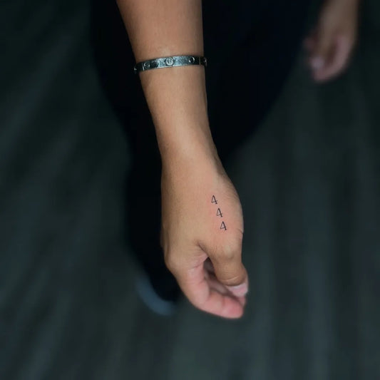 Tiny Minimalist Three Delta Symbols on Women Hand Tattoo by @jonnyblackink