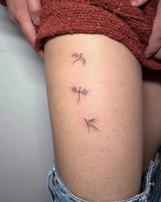 Tiny Minimalist Three Flying Birds on Women Thigh Tattoo by @cassiendtattoos