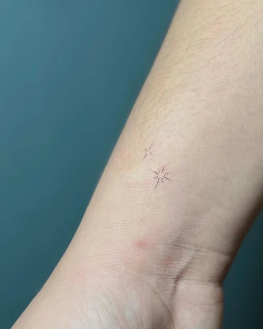 Tiny Minimalist Two Stars on Women Wrist Tattoo by @renz.meliora_tattoo