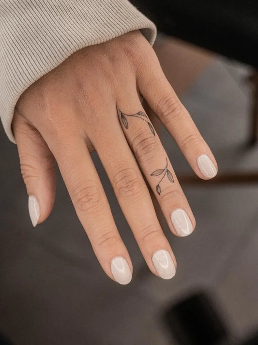 Tiny Minimalist Vine on Women Hand Tattoo by @richi.tats