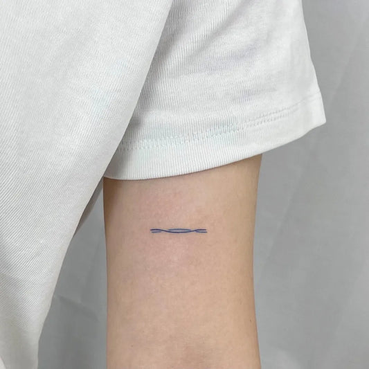 Tiny Minimalist Wave Tattoo on Women Forearm by @rieul_tt