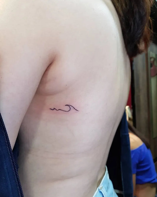 Tiny Minimalist Wave Tattoo on Women Rib by @ibf2