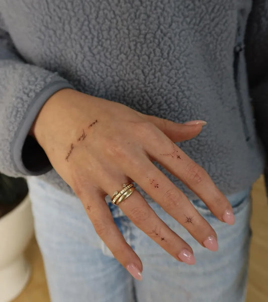 Tiny Minimalist Words on Women Fingers Tattoo by @tattoobynastya