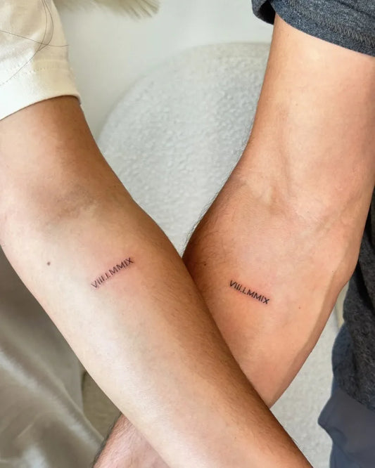 Tiny Minimalist Wordson Couple Arms Matching Tattoo by @bossybtattoos