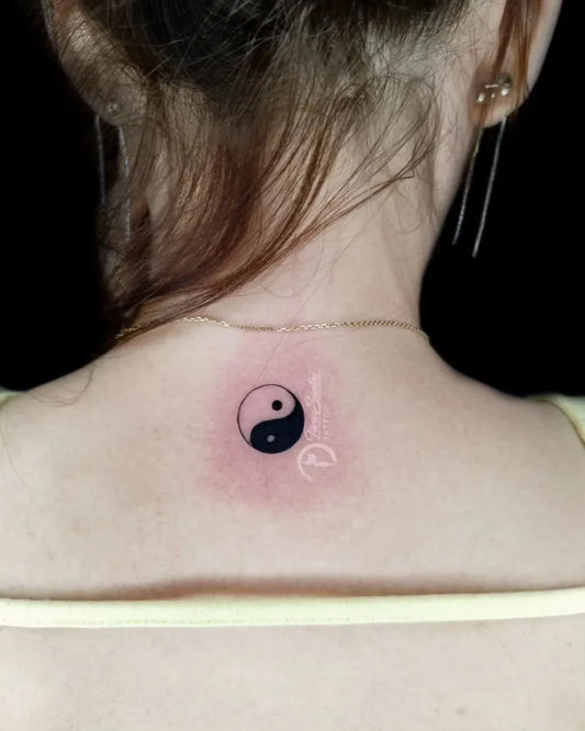 Tiny Minimalist Yin Yang Tattoo on Women Back by @taniasantostattoo