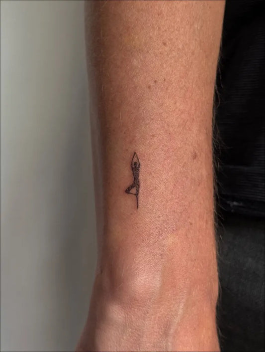 Tiny Minimalist Yoga Pose on Women Arm Tattoo by @mamooodi_ink