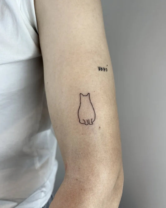 Tiny Minimalist cat silhouette on Women arm Tattoo by @kylin.tattoo