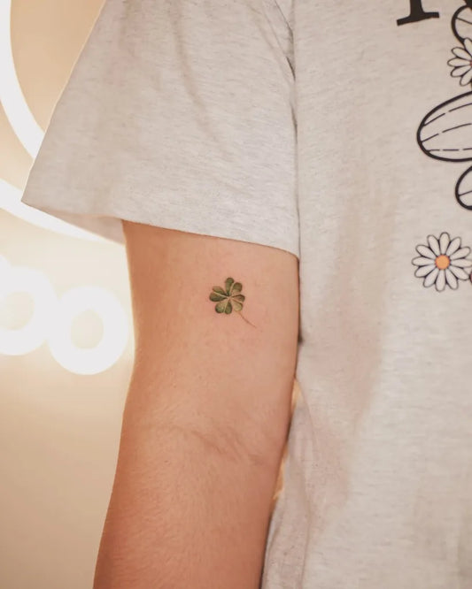 Tiny Minimalist four leaf clover on Women Arm Tattoo by @the8tattoostudio