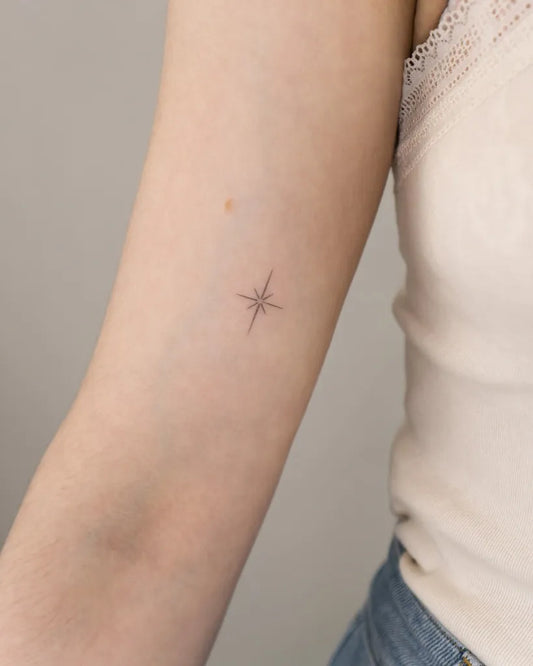 Tiny Minimalist star on Women arm Tattoo by @vladkork
