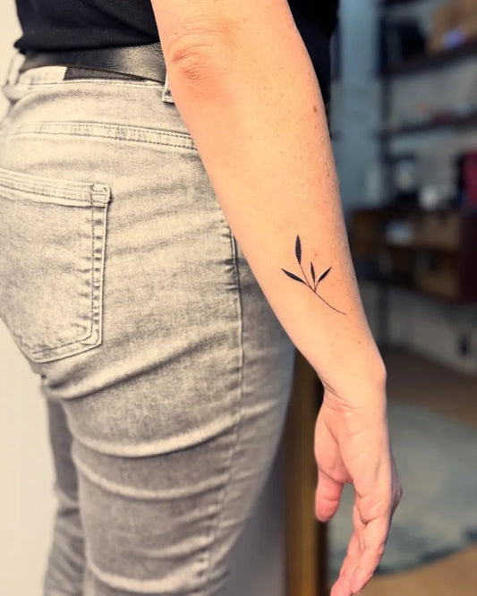 Tiny Minimalist wheat stalk on Women forearm Tattoo by @sarahhofmann_ink