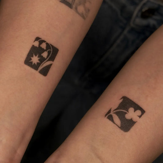 Tiny Negative Space Flowers and Star Tattoo on Women Wrist by @citruslucy.ink