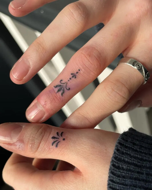 Tiny Ornamental Floral Dots Tattoo on Women Finger by @isla____tattoo