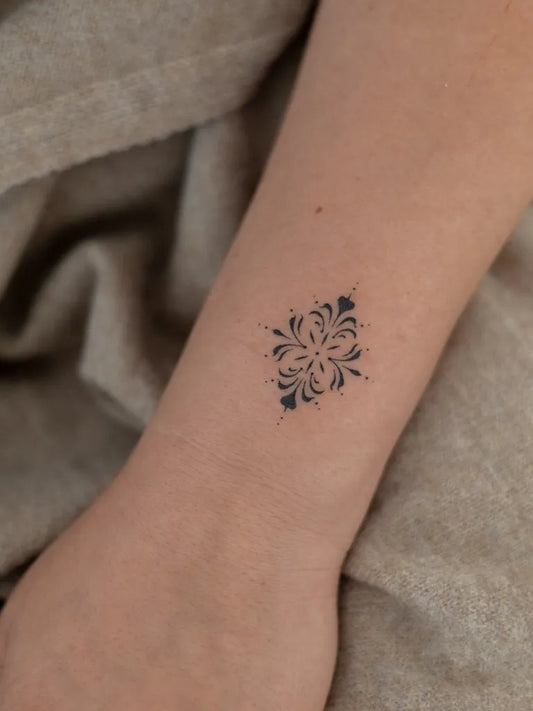 Tiny Ornamental Mandala Tattoo on Women Wrist by @tatitattoos