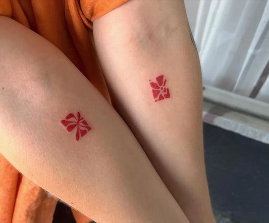 Tiny Red Floral Design Tattoo on Women Arm by @3anban