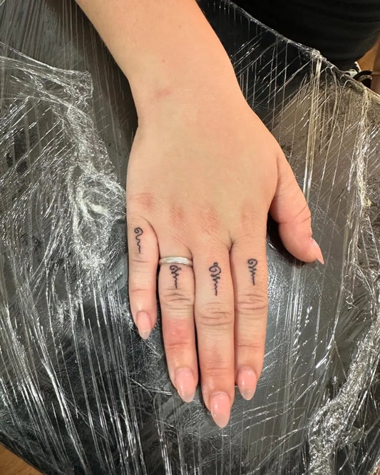 Tiny Sak Yant Rose and Yant Symbols Tattoo on Women Fingers by @preservation_khmer_sakyant