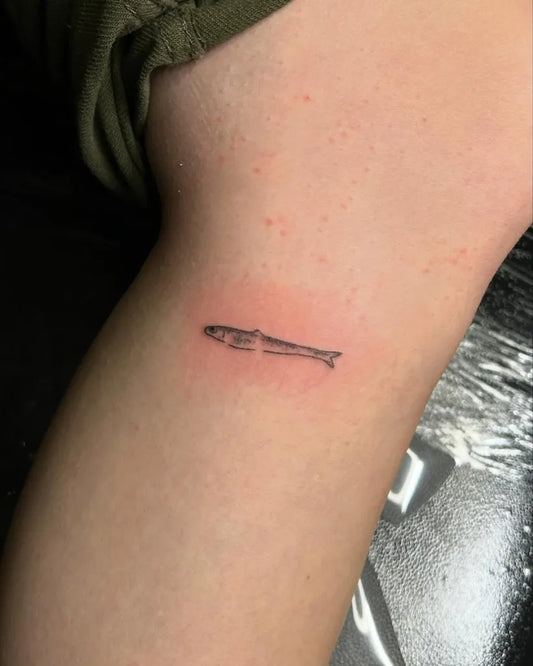 Tiny Stick and Poke Fish Tattoo on Women Forearm by @littletinypoke