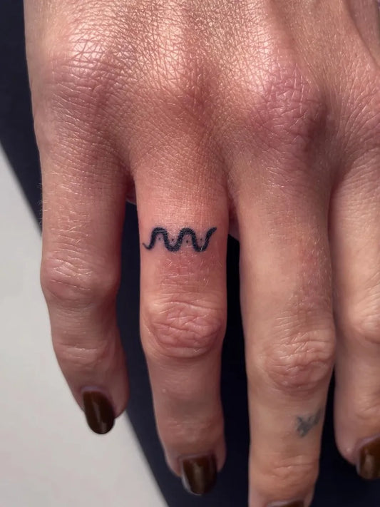 Tiny Stick and Poke Wave Tattoo on Women Finger by @lily_gloria_tattoo