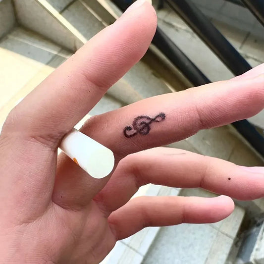 Minimalist Tiny Treble Clef Semi-Permanent Temporary Tattoo on Finger