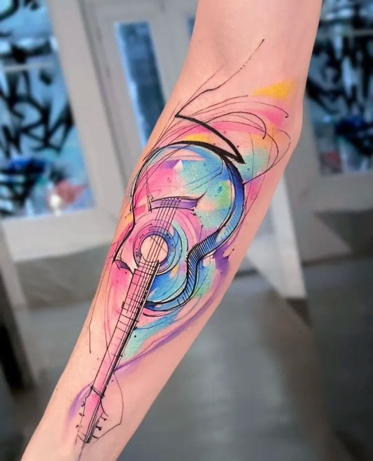 galaxy watercolor abstract guitar tattoo on forearm