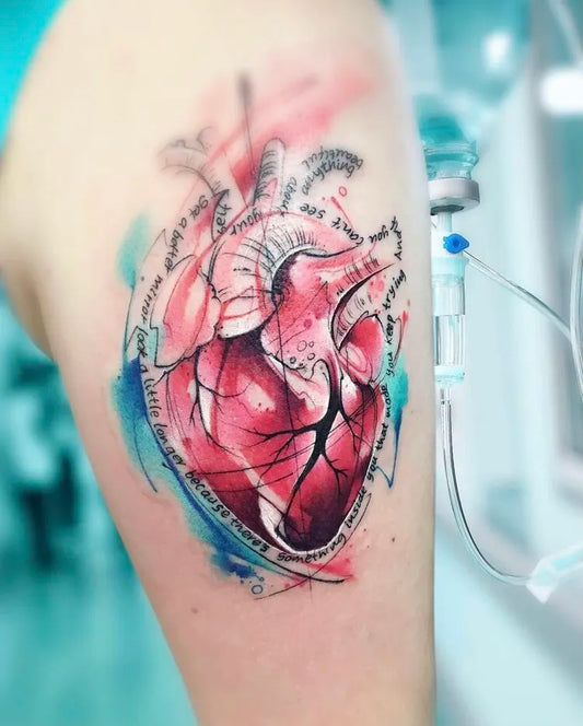 watercolor anatomical heart tattoo on a person's arm with medical equipment in the background