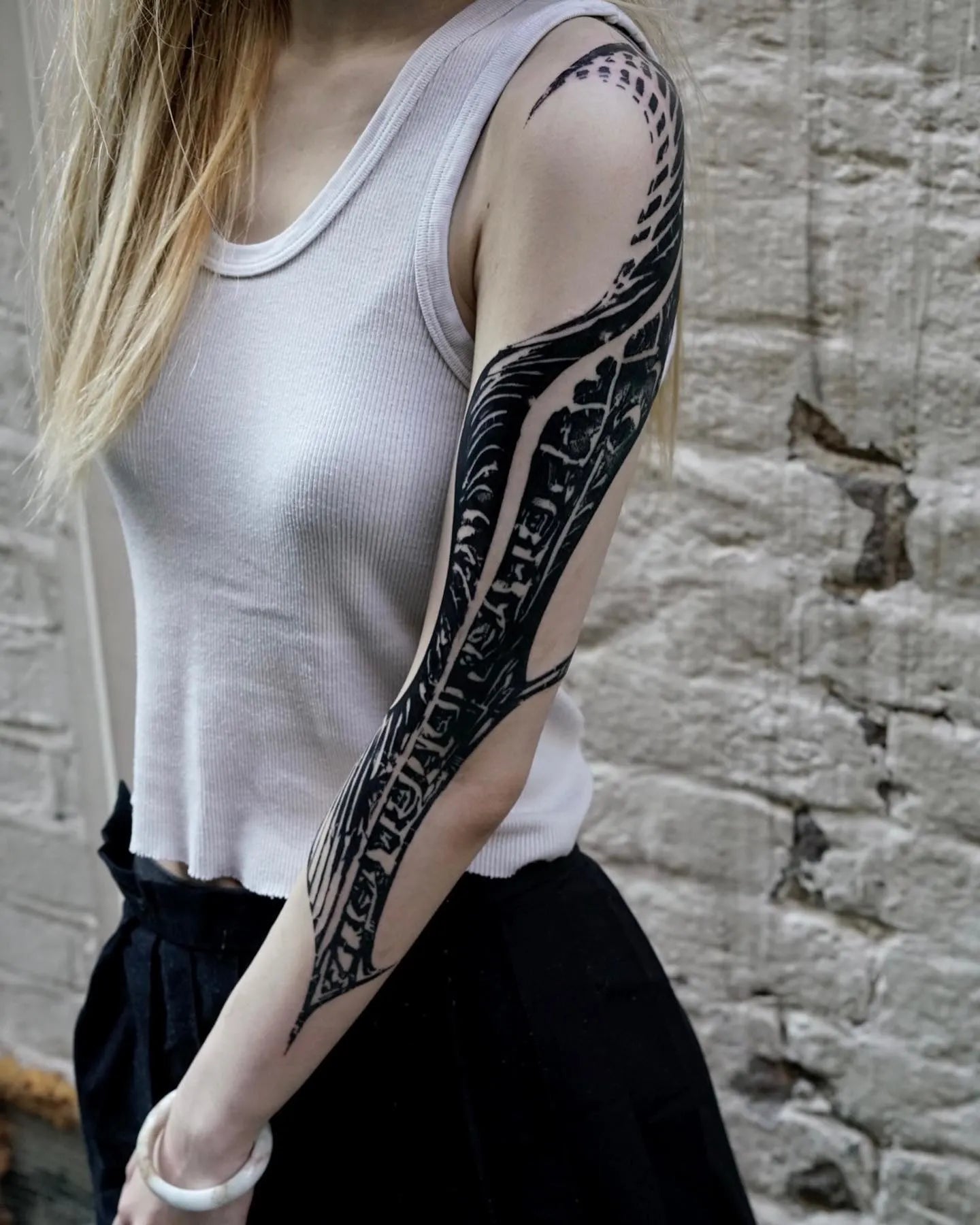 blackwork tattoo on woman full arm sleeve