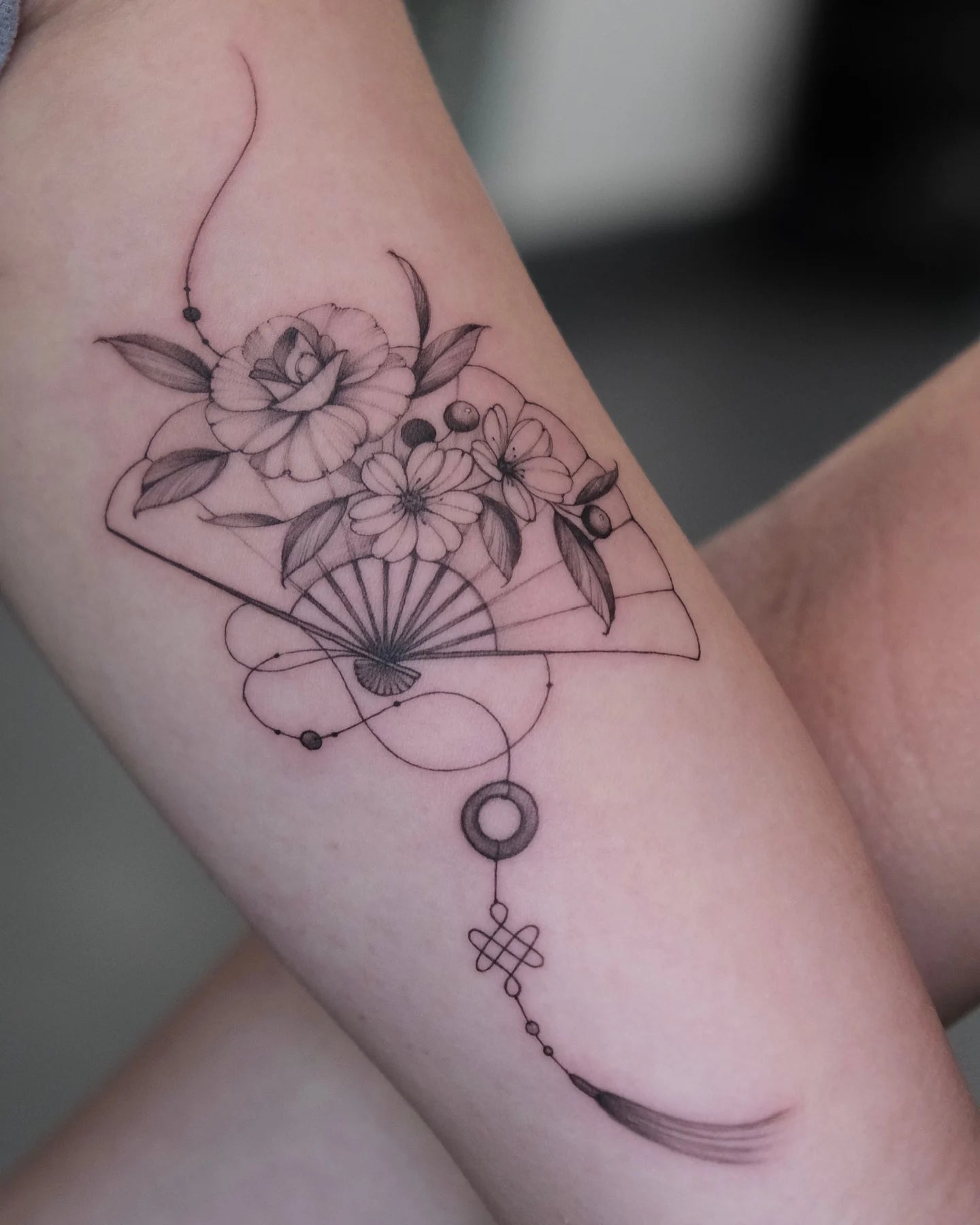 flower and japanese fan fine line tattoo on arm