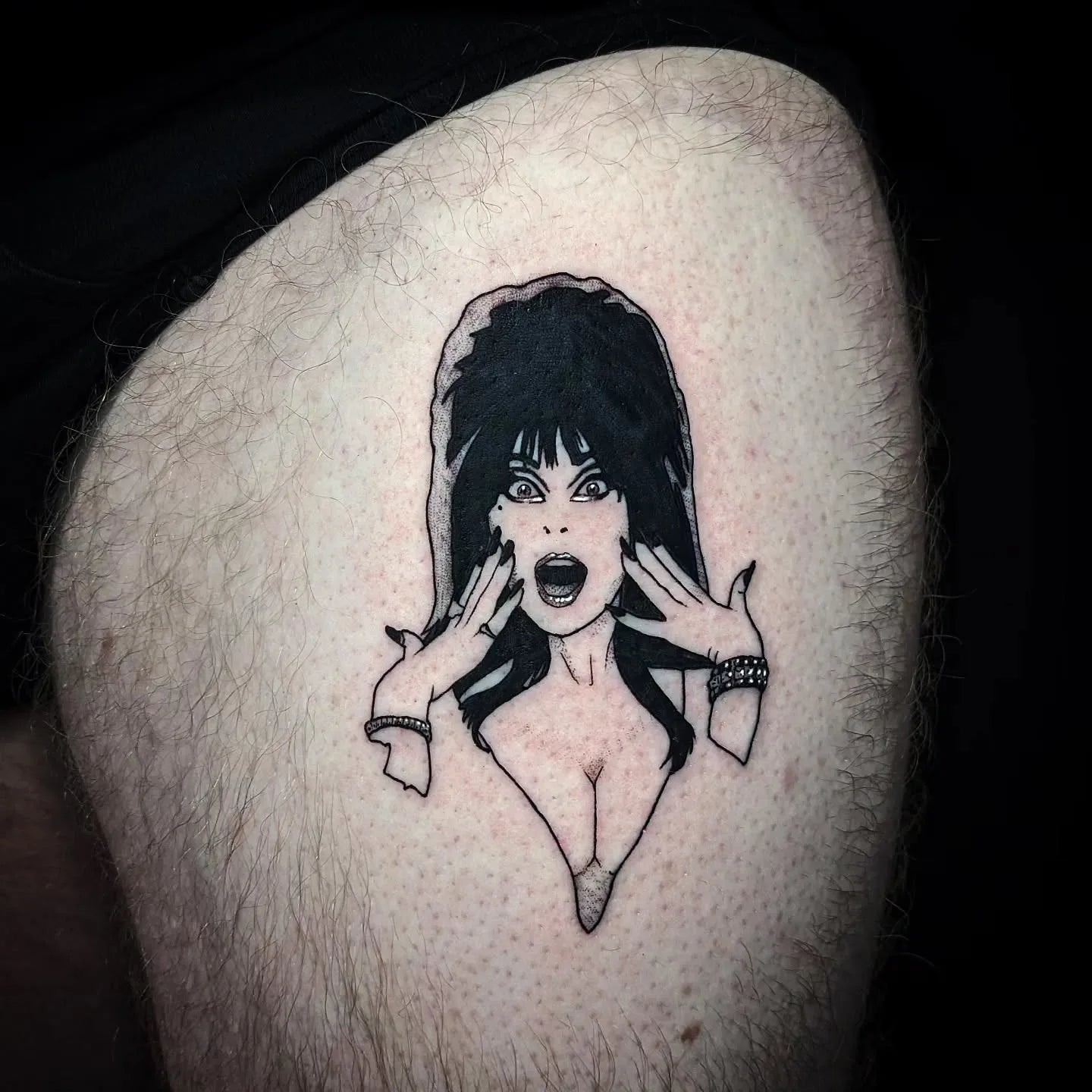60s 70s long hair woman illustrative tattoo on thigh