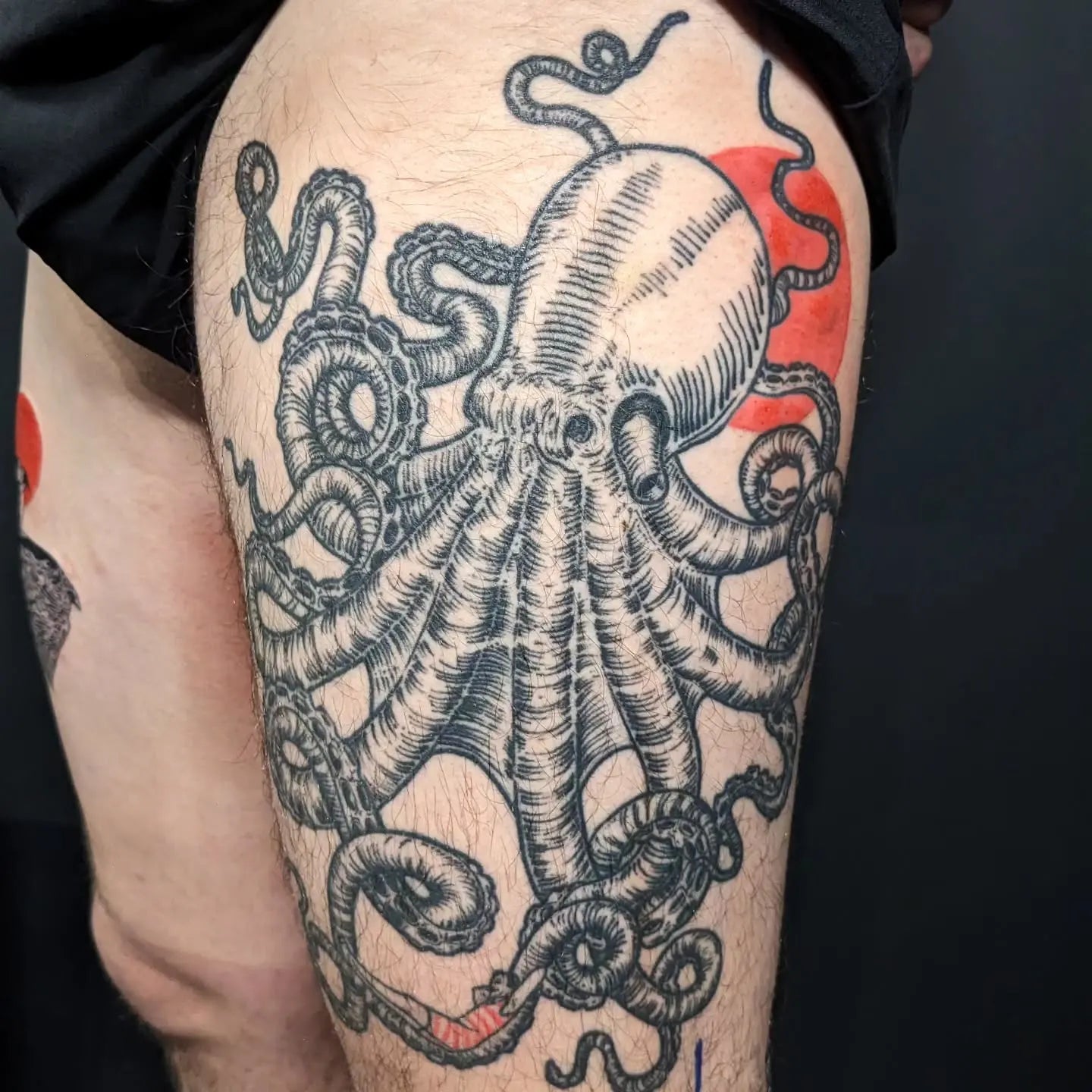 Detailed octopus tattoo on thigh