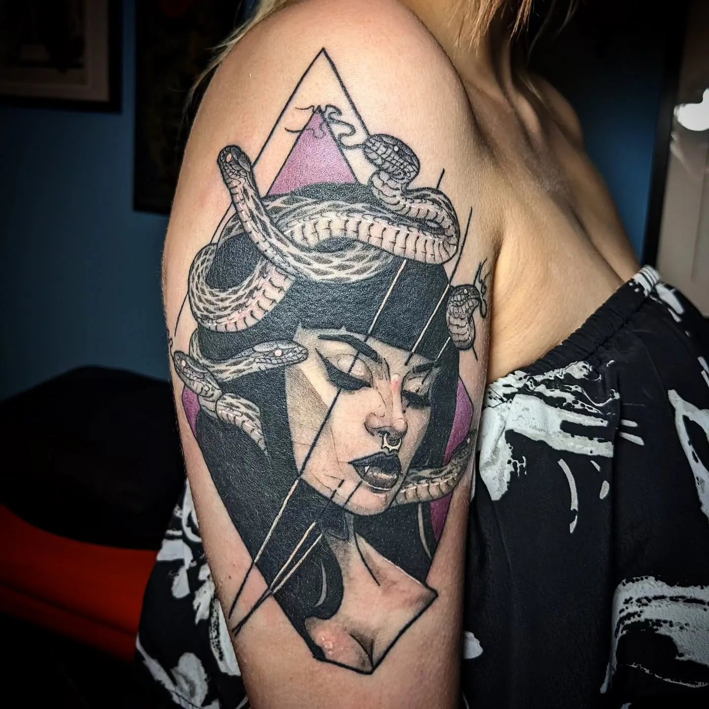 neo traditional medusa tattoo on woman upper arm
