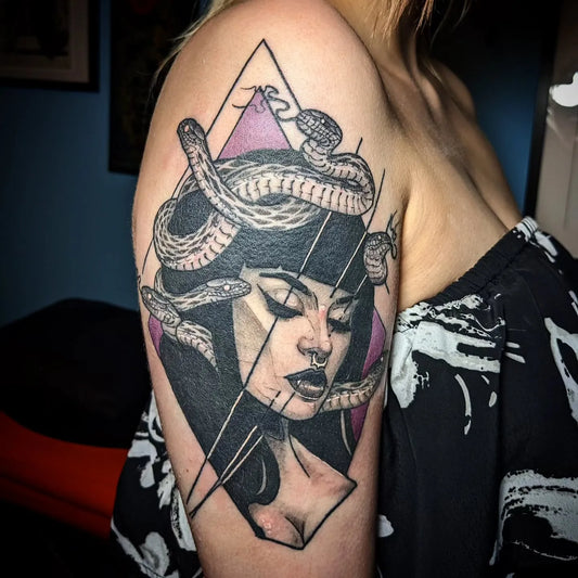 neo traditional medusa tattoo on woman upper arm
