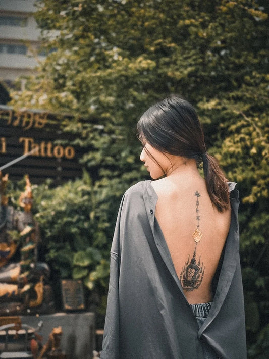 traditional Sak Yant tattoo on woman back