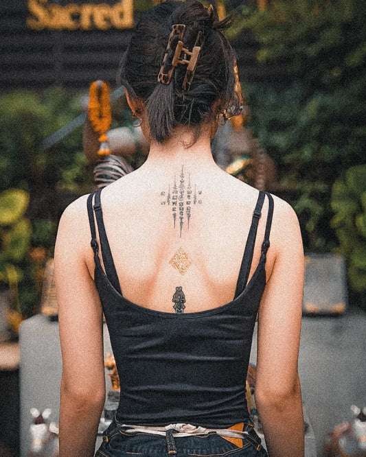 traditional Sak Yant tattoo on woman back