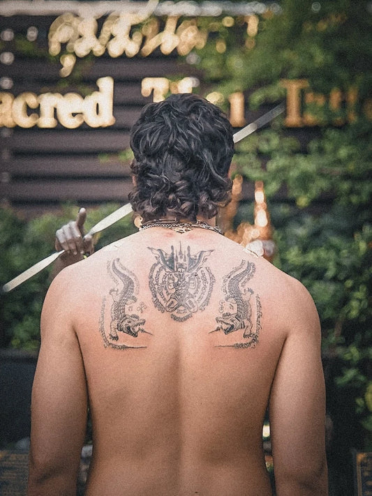 traditional Sak Yant alligators tattoo on man back