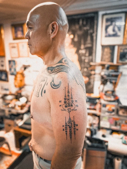 traditional Sak Yant tattoo on man arm