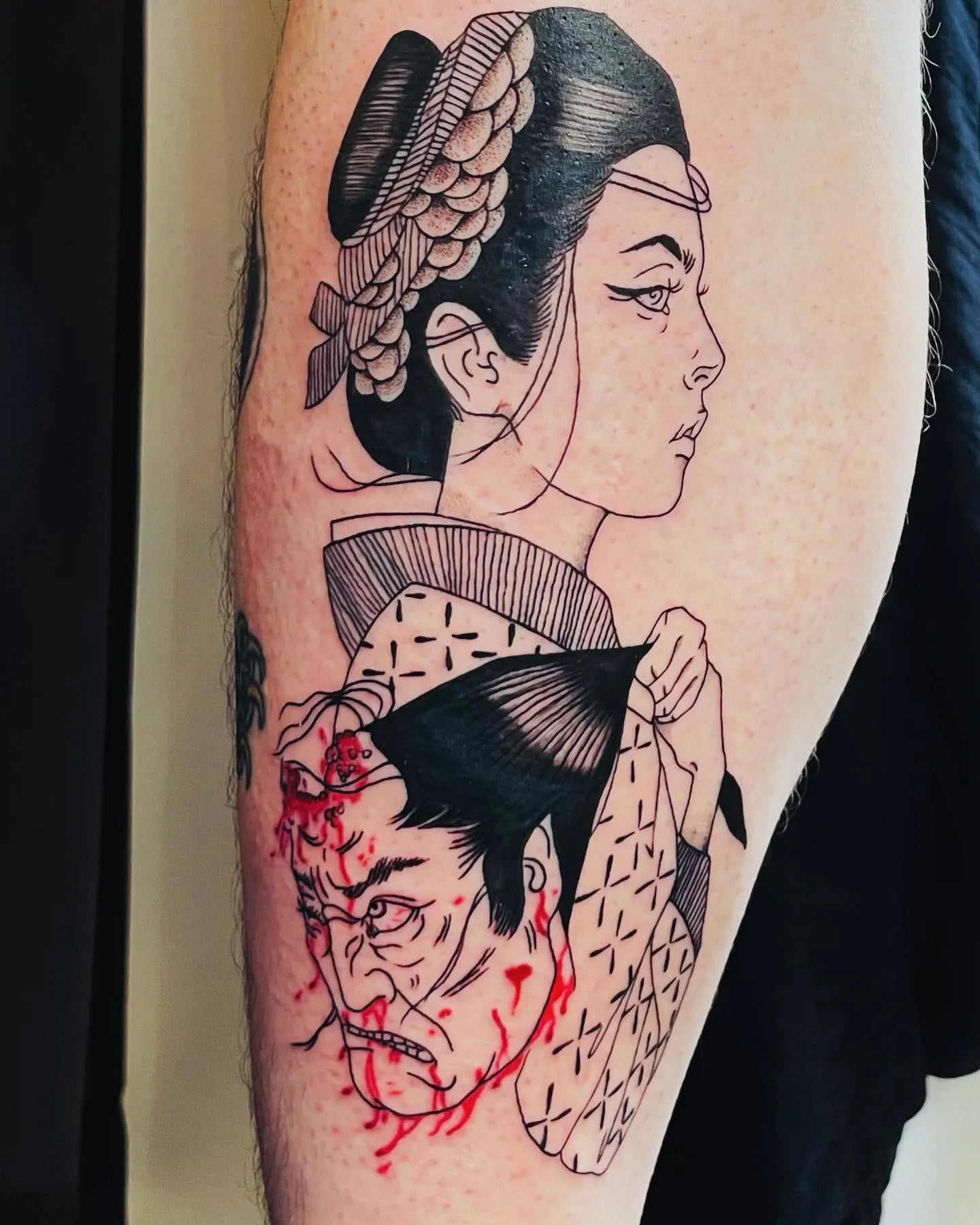 Tattoo of a traditional Japanese geisha and samurai