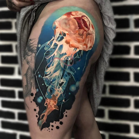 jellyfish color realism tattoo on woman thigh