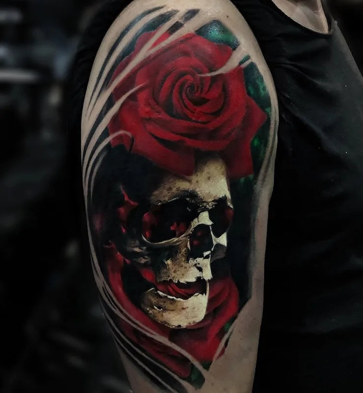 red rose and skull color realism tattoo on man upper arm