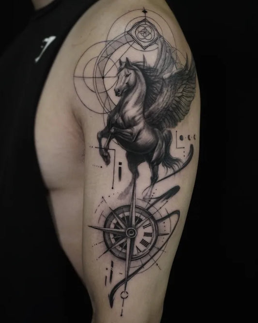 Winged Horse and Compass Tattoo on man upper arm