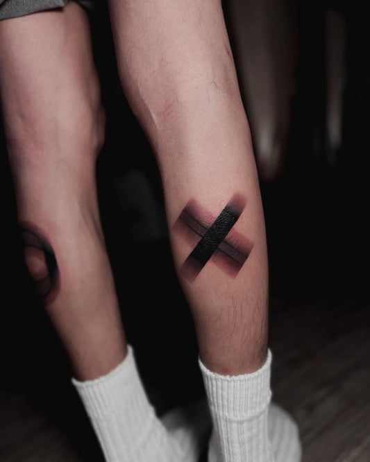 blurry XO calf tattoo
