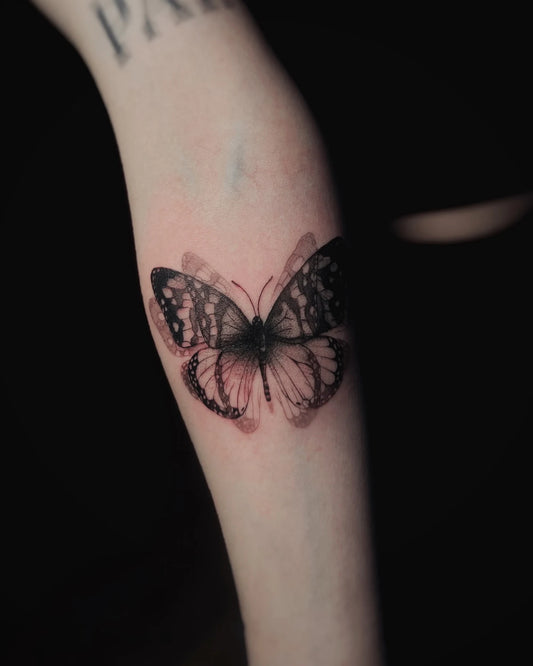 blurry butterfly tattoo