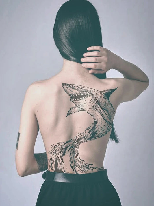 giant shark black and grey illustrative tattoo on woman back