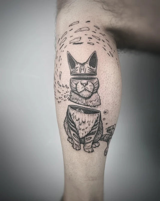 black and grey cat in pieces darkwork abstract tattoo on leg