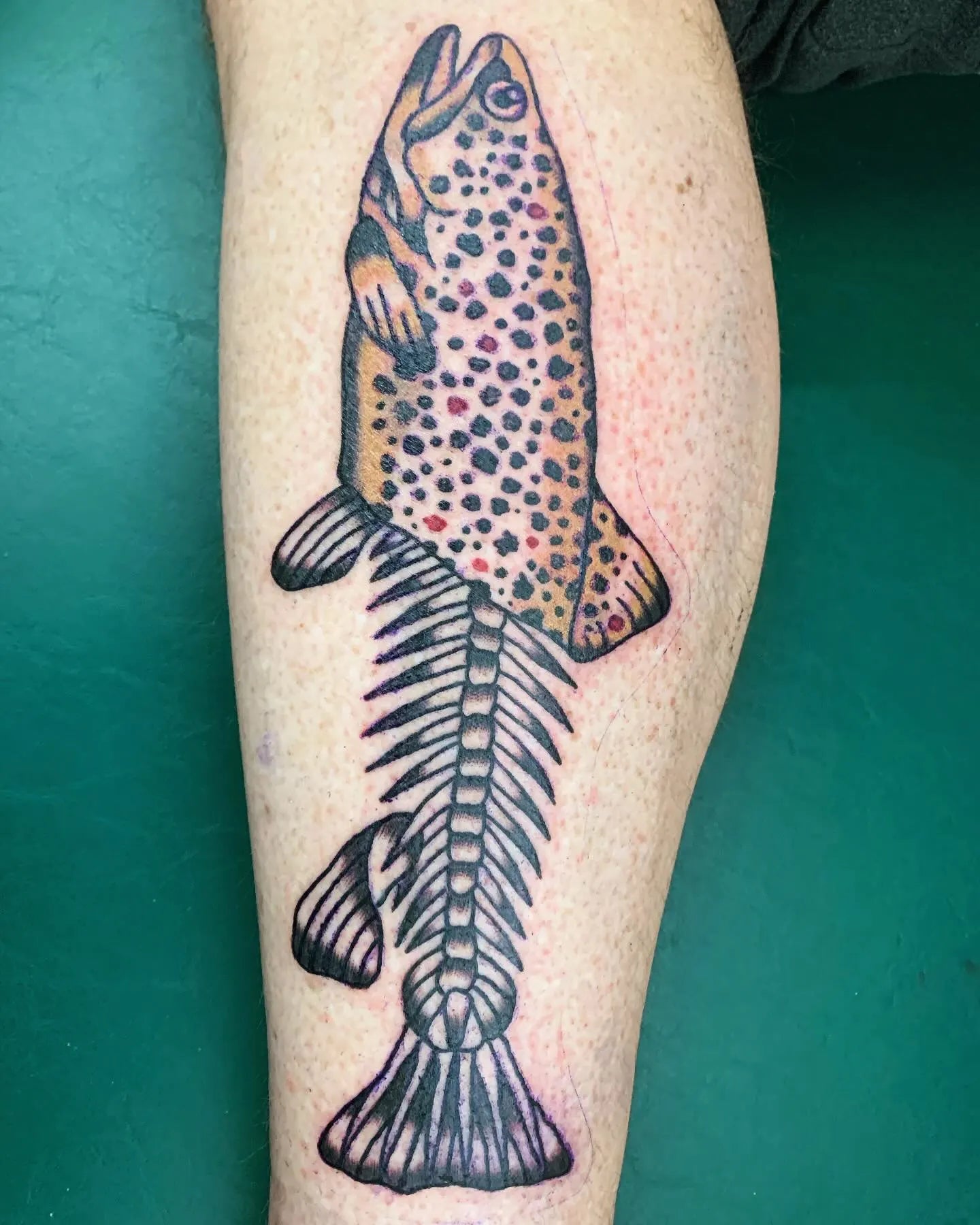 half fish bone tattoo