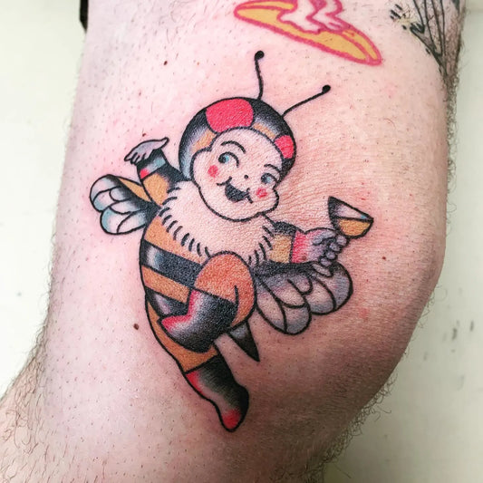 happy cartoon bee holding martini tattoo
