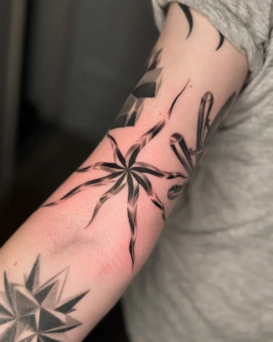 black and grey dotwork 3d starfish tattoo on upper arm