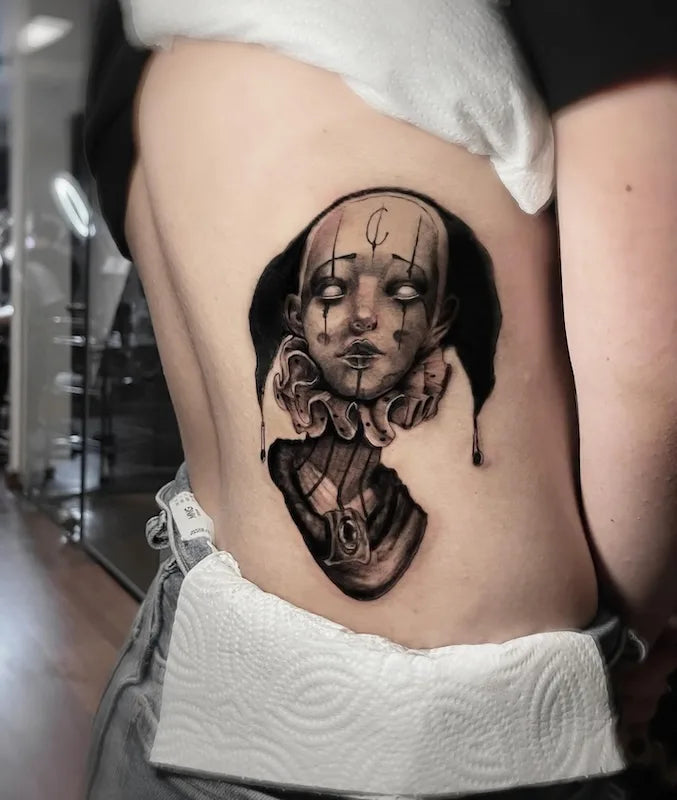 creepy woman clown black and grey realism darkwork tattoo on back